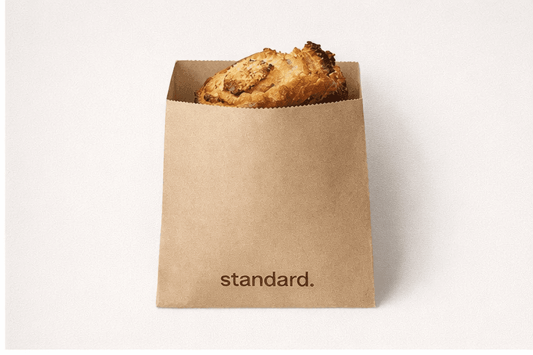 Kraft pastry bag holding a laminated pastry